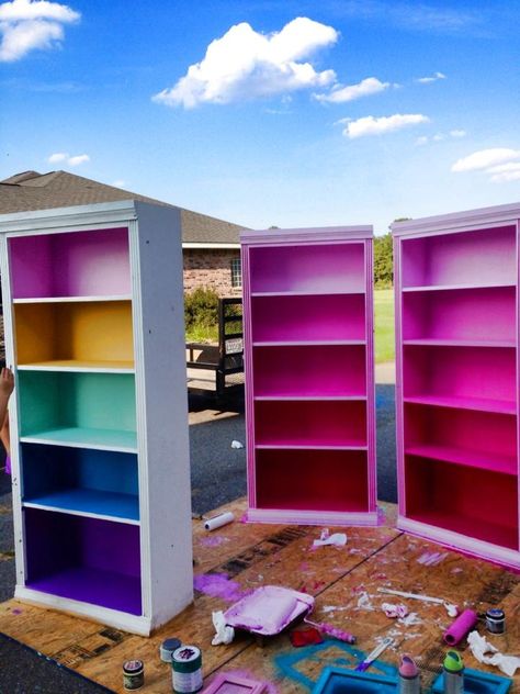 Colored book case, kids book case Rainbow Painted Bookshelf, Painted Book Cases Ideas, Cloud Couch Colorful, Eclectic Playroom Ideas, Maximalist Bookcase, Fun Colorful House Interior, Colorful Maximalist Decor Office, Funky Painted Bookshelf, Colorful Interior Decor