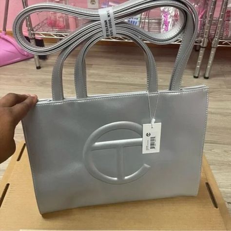   Telfar Medium Metallic Silver Shopping Bag   Telfar Bags, Telfar Bag, Telfar Handbags, Logo A, Silver Shop, Survival Kit, Bubblegum Pink, Medium Bags, Embossed Logo