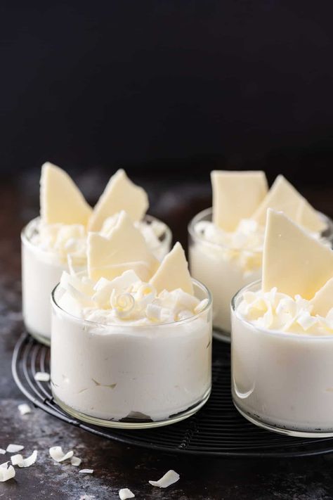 4 glass cups filled with white chocolate mousse on dark background White Choc Mousse, Desserts In A Glass Cup, Wedding Mousse Cups, Chocolate Glass Dessert, Filling For Chocolate Cups, Chocolate Cups With Mousse, White Chocolate Mousse Cups, White Chocolate Snacks, Chocolate Cups Filling