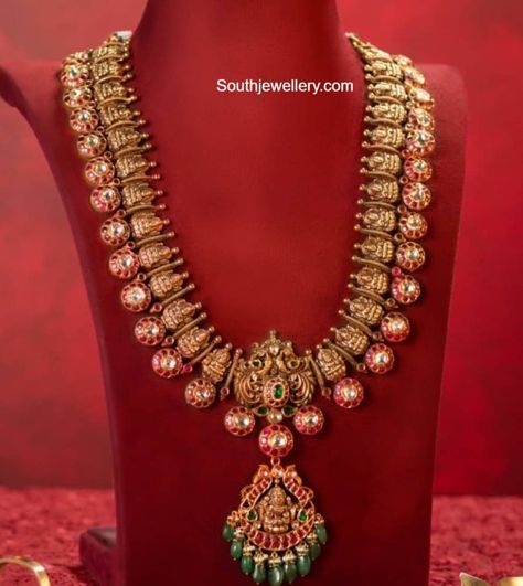 22k gold antique Lakshmi bottu haram adorned with rubies, emeralds, uncut diamonds by Krishna Jewellers, Pearls Kundan Bottu Mala, Bottu Mala, South Sea Pearl Necklace, Bridal Diamond Necklace, Peacock Pendant, 22 Carat Gold, Indian Jewellery Design, Diamond Necklace Set, Emerald Bead