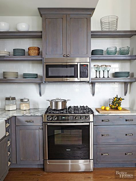 Open shelves eliminate the heavy look of closed cabinetry and lighten up small spaces. Closed base cabinets provide storage for utilitarian, not-so-display-worthy pieces while keeping the visual bulk below eye level. Placing the microwave above the range frees valuable counter space for cooking while keeping it out of kids' reach. Ad Kitchen, Microwave Cabinet, Cabinet Shelves, Microwave In Kitchen, Small Kitchen Storage, Cabin Kitchens, Kitchen Redo, Open Shelves, Base Cabinets