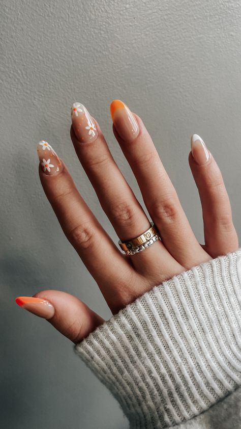 Orange Oval Nails Designs, Oval Shaped Nails Summer, Coloured French Almond Nails, Orange Nails White Flowers, Orange And White Tip Nails, Short Almond Acrylic Nails Orange, Orange Nails Oval Shape, Orange Nails With French Tip, Flower Nail Designs Orange