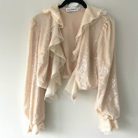 Measurements: 14.5”L, 18.5”W Details: Elasticated Wrists, Beautiful Sequin And Tulle Ruffle Front, Cropped Fit Condition: New Offers Welcome! Ruffle Cardigan, Sequin, Jackets & Coats, Cream, Women Shopping, Clothes