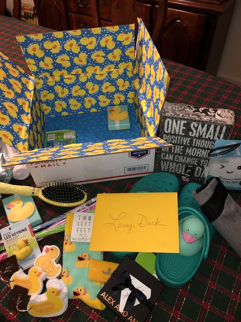 Duck care package. Included yellow and blue items, rubber ducky, gift cards and things for our “Lovey Duck” Rubber Duck Gift Ideas, Duck Themed Gifts, Funny Care Package Ideas, Duck Gifts Ideas, Duck Things, Duck Care, Rubber Duck Birthday, Diy Care Package, Duck Collection