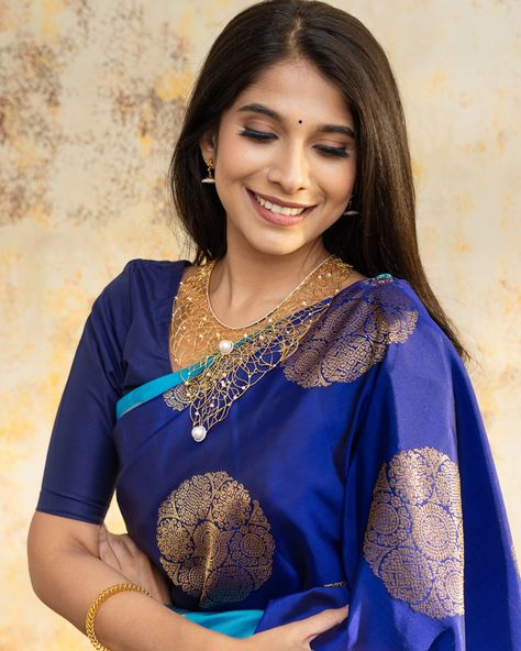 Our Heritage Collection This dark Blue Kanjeevaram silk saree from our Heritage collection exudes a rich, enchanting allure. Adorned with Alankara Kamalam butta scattered across the body, it whispers tales of tradition and elegance. Paired with Yaanai-Kuthirai Retta Pettu Ananda blue border, this saree adds a touch of natural beauty and charm. Blue Saree Look, Saree Look Traditional, Dark Blue Saree, Kanjeevaram Silk Saree, Blue Border, Blue Saree, Saree Look, Heritage Collection, Silk Saree