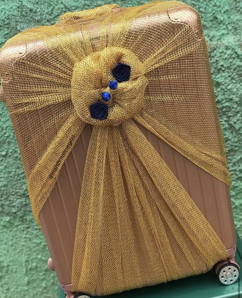 Rose gold suitcase wrapped in gold net with blue roses for engagement dowry wrapping. Rose Gold Suitcase, Traditional African Wedding, Ghana Traditional Wedding, Engagement Gift Baskets, Bridal Boxes, Bridal Gift Wrapping Ideas, Wedding Gift Wrapping, Galaxy Wallpaper Iphone, Bridal Gift