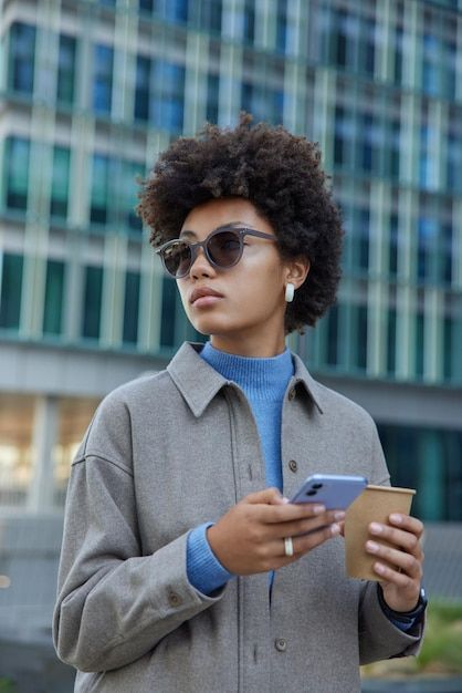 Attractive young curly haired woman wear... | Free Photo #Freepik #freephoto #woman-phone #people-with-phone #people-with-smartphone #using-mobile Person Looking At Phone, Person On Phone, Phone Lifestyle, Woman With Curly Hair, Blind Girl, Studio Website, Drinks Coffee, Reference Pics, Brand Shoot