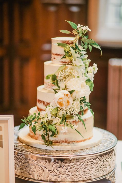 Semi Naked 4 tier wedding cake at Jesmond Dene House in Newcastle, by Dreamworld Cakes, adorned with a garland of white & green fresh flowers and foliage such as Peony, Jasmine and Eucalyptus. Image by Helen Russell Semi Naked Wedding Cake With Flowers, Wedding Cake Olive Green, Wedding Cake Spring Flowers, Wedding Cake Flowers Cascade, Elegant November Wedding, Wedding Cake Olive, Botanical Wedding Cake, Wedding Cake With Fresh Flowers, Jesmond Dene