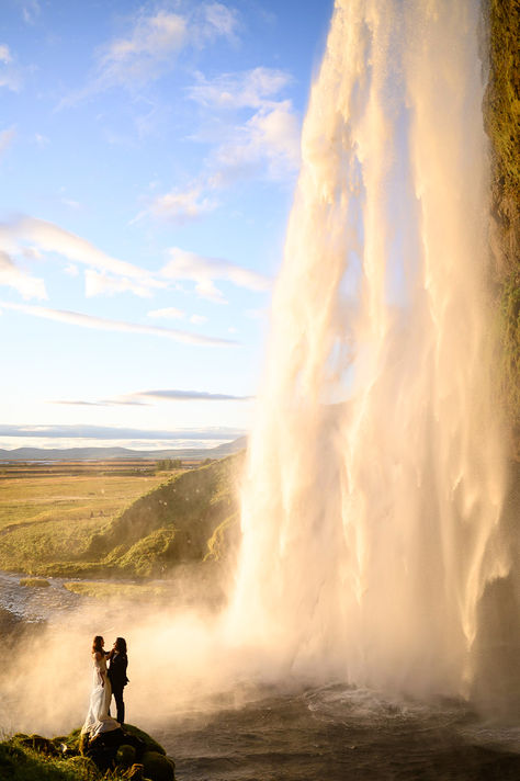 An incredible adventure elopement around Iceland at waterfalls and black sand beach  Wedding Photography by Julia Goldberg Photography