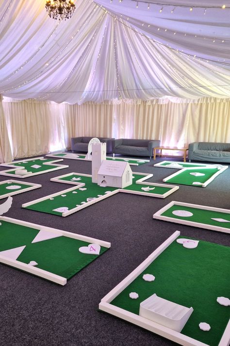 Crazy golf makes ideal entertainment at wedding receptions. It's an activity that guests of all ages and abilities can get involved in, and is always a great ice-breaker for families & friends to mingle over. Putterfingers White Wedding crazy golf course makes a great focal point has a real WOW factor. The course itself is portable and suitable for any level surface, indoors and out. Visit Portable Mini Golf - Crazy Golf Hire | PutterFingers to find out more. #weddingplanning #weddingcrazygolf Entertainment At Weddings, Mini Golf Wedding Reception, Mini Golf At Wedding, Wedding Crazy Golf, Wedding Mini Golf, Diy Mini Golf Course Ideas, Backyard Mini Golf Course, Mini Golf Aesthetic, Golfing Aesthetic