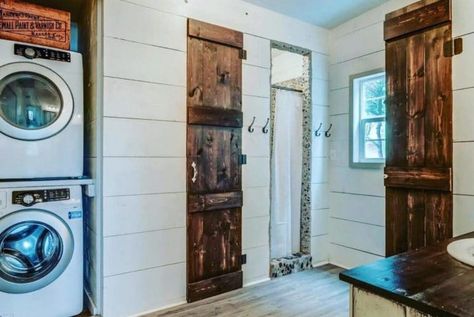 Fall in love with this stunning red cottage in farmhouse style with modern functionality complete with a full kitchen and 3 bedrooms for comfort! #TinyHouseTours #TinyHouse #Farmhouse #RusticTinyhouse #Cottage #TinyHouseCottage #TinyHouseFarmhouse #Shiplap Pebble Tile Shower, Simple Ceiling Fan, Rustic Tiny House, Tiny Farmhouse, Tiny House Cottage, Cottage Tiny House, Shiplap Bathroom, Metal Building Home, Small Cottages