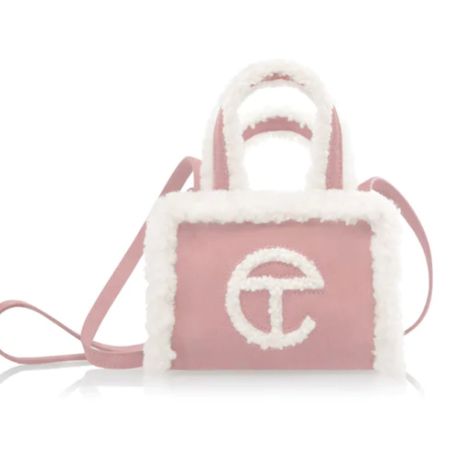 Our Iconic Unisex Telfar Bag Made In Collaboration With Ugg In Genuine Pink Suede With A Cuddly Shearling Trim. Bag Features Double Strap To Be Worn Cross-Body, Inlaid Shearling Telfar Logo, 100% Cotton Lining And Magnetic Snap Closure. Same Size As Our Small Shopping Bag. Small Is The Party-Bag + The Afterparty Too. Materials: Outer: 100% Genuine Suede W/ Shearling Trim Lining: 100% Cotton Dimensions: (Height 4 3/4", Width 6 5/8", Depth 3 1/8", Drop 21") Telfar X Ugg, Telfar Bags, Ugg Bag, Boho Handbags, Tan Handbags, Small Makeup Bag, Monogram Handbag, Girly Bags, Luxury Purses