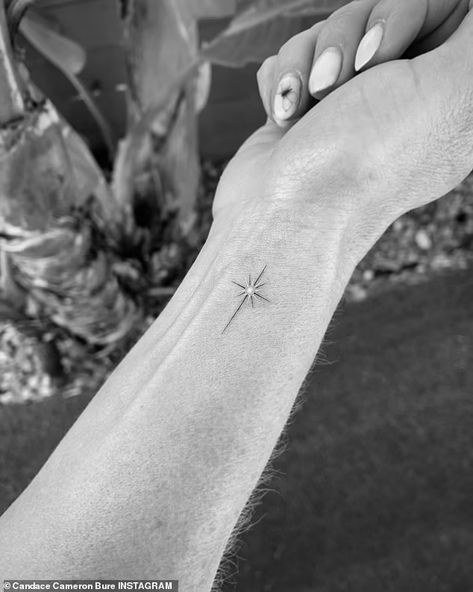 Candace Cameron Bure shows off new cross tattoo on the inside of her wrist | Daily Mail Online Delicate Cross Tattoo For Women, Dainty Cross Tattoos For Women, True North Tattoo, Tattoo Amigas, North Star Tattoo, Star Tattoo On Wrist, North Star Tattoos, Sparkle Tattoo, Small Star Tattoos