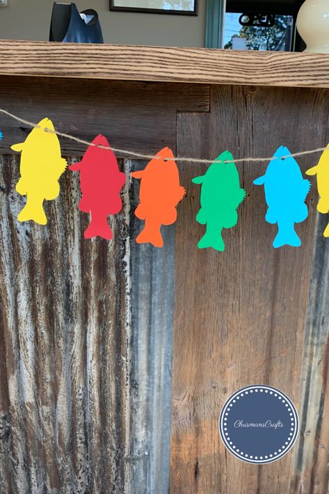 This fishing theme banner is made out of cardstock, either regular or heavy. It comes with 10 fish total and is strung on your choice of twine (my favorite with this banner), white or black ribbon. Don't hesitate to reach out and ask me any questions! I am more than happy to answer! :) Check out my instagram pages; ChrismansCrafts *AND* organizedchaos__ Fish Classroom Decorations, Fish Classroom Door, Rainbow Fish Display Board, Fishing For A Good Book Bulletin Board, School Of Fish Wall Decor, Fish Banner, Banner White, Fish Theme, One Fish Two Fish