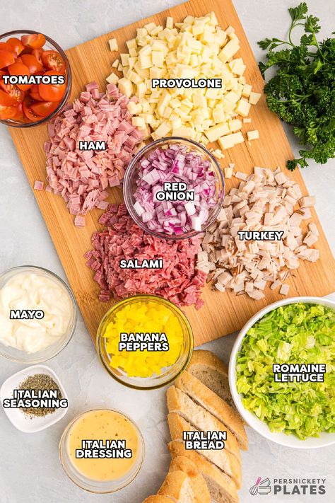 This easy Hoagie Dip takes everything you love about an authentic Italian hoagie and turns it into delicious dip form. All the deli meat and cheeses chopped and tossed with a creamy Italian dressing and scooped up with crusty baguette slices. Skip the sub shop and make this at home for a new favorite! | www.persnicketyplates.com Chopped Italian Dip, Deli Meat Meal Prep, Italian Chopped Salad Subs, Italian Chop Sandwich, Hoagie Chopped Salad, Deli Meat Recipes Healthy, Deli Ham Lunch Ideas, Easy Hoagie Sandwiches, Chopped Sandwich Salad