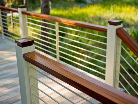 An essential safety feature, your deck railing is also a key component of your overall deck design. Horizontal Deck Railing, Wood Deck Railing, Metal Deck Railing, Deck Railing Ideas, Patio Railing, Hgtv Dream Homes, Deck Railing Design, Metal Railing, Modern Porch