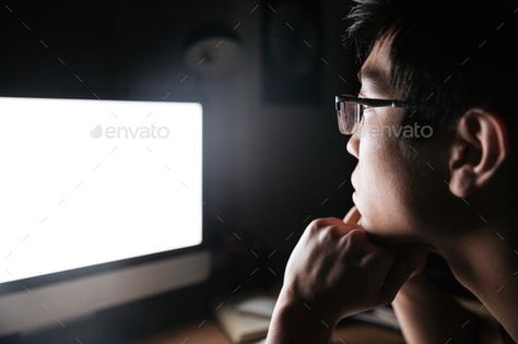 Concentrated man in glasses looking at blank screen of computer by vadymvdrobot. Concentrated asian young man in glasses looking at blank screen of computer in dark room #AD #blank, #screen, #glasses, #Concentrated Person Looking At Computer, Camera Shots And Angles, Looking At Computer, Pet Duck, 4 Drawing, Diy Background, Computer Drawing, Blank Screen, Background Diy