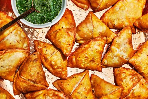 These spiced chicken samosas are flaky and bursting with flavor from the garam masala-spiced chicken and mint chutney served alongside. Samosa Photography, Chicken Samosas, Johnny Cakes, Johnny Cake, Sugar Dough, Dark Meat, Chicken Spices, Caribbean Recipes, Freezer Friendly