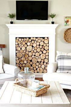 DIY faux fireplace with tv mounted over the fireplace - www.goldenboysandme.com Winter Mantle Decor, Faux Fireplace Mantels, Diy Outdoor Fireplace, Faux Fireplace Diy, Wooden Fireplace, Art Deco Living Room, Small Fireplace, Fireplace Mantel Decor, Living Room Small