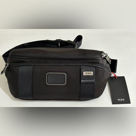 Brand New With Tag Tumi Men Milton Belt Bag / Fanny Pack Black Great Stylish Bag With Multiple Pockets For Everyday, Casual And Traveling Use Features: - 12.25” (W) X 6.1” (H) X 0.25" (D) - Adjustable Strap With Quick-Release Buckle Can Be Worn Around Waist Or Crossbody - Zip Entry To Main Compartment - Large Front Zip Pocket - Back Magnetic Pocket .. Great Keep For Cell Phone Fast Shipping!! All My Items Come From Smoke And Pet Free Environment. We Only Sell Brand New And 100% Authentic Merchandise. Shop With Confidence Thank You For Looking & Happy Shopping Tumi Bags, Merchandise Shop, Quick Release Buckle, Stylish Bag, Quick Release, Fanny Pack, Belt Bag, Zip Pockets, Happy Shopping