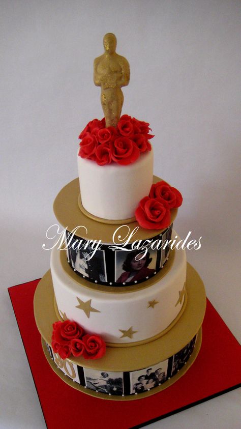 This cake was a birthday cake for a 90 year old woman who loved movies and was an extra in movies and acted in commercials.  I decided to show her "life in pictures" on the cake.  The roses are chocolate.  The oscar is edible as well Red Carpet Theme Cake, Hollywood Cake Ideas, Hollywood Birthday Cake, Old Hollywood Cake, Hollywood Theme Cake, Red Carpet Cake, Hollywood Theme Party Decorations, Hollywood Cake, Theatre Cake