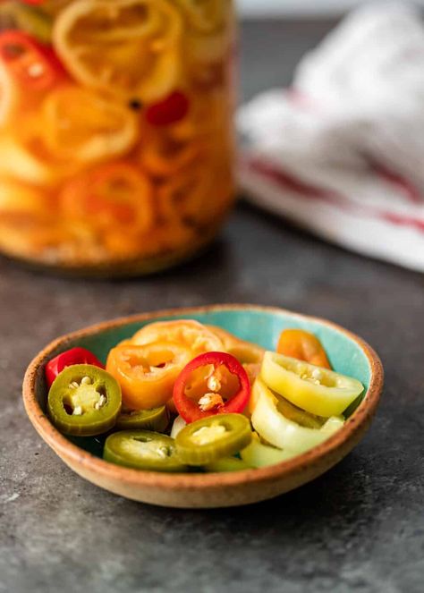 My quick pickled peppers brine is made with vinegar, black pepper, mustard, and celery for a crisp bite and intoxicating heat. How To Make Pickled Peppers, Pickled Cherry Peppers, Canning Hot Peppers, Pickled Pepper Recipe, Pickled Vegetables Recipe, Cherry Peppers, Pickled Cherries, Pickled Peppers, Jamaican Dishes