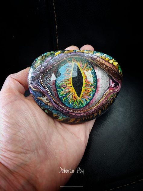 painting rocks! | Dragon eye number 9 | Facebook Dragon Eye Rock Painting Tutorial, Dragon Eye Painting, Painted Pebbles, Rock Painting Tutorial, Dragon Face, Acrylic Landscape, Beach Rocks, Painting Rocks, Eye Painting