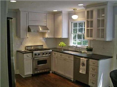 White kitchen with great lighting about the sink and a white subway backsplash Small House Kitchen Design, Small House Kitchen Ideas, Small House Kitchen, Small Kitchen Inspiration, Tiny Kitchen Design, Small Kitchen Layouts, Farmhouse Kitchen Remodel, Black Kitchen Cabinets, New Kitchen Cabinets