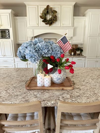 190K views · 3.3K reactions | 4th of July kitchen centerpiece!🇺🇸 Comment LINK and I’ll send you links to everything I used!😍 or everything is linked in my bio!I thought this would be perfect for 4th of July!🇺🇸  I wanted it to be classy and festive at the same time! The star candles are battery operated and I’m obsessed with them!! I also equally love the red tulips. 😍Do you decorate for the 4th of July?😍I think I’m going to do my porch next week!#patriotic #patrioticdecor #fourthofjuly #4thofjuly #4thofjulydecor #fourthofjulydecor #summerdecor #centerpieceideas #centerpieces #centerpiecesidea #diyhomedecor #redwhiteandblue #starsandstripes | Our Winton home | Lucky Socks · Belong Together (Sped Up) July 4th Centerpieces, 4th Of July Flower Arrangements, Fourth Of July Centerpieces, 4th Of July Centerpieces, Fourth Of July Table Decor, 4th Of July Tablescapes, 4th Of July Flowers, Star Candles, 4th Of July Home Decor