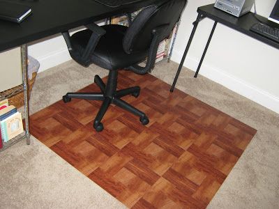 I ran out to Home Depot and picked up this 4' x 4' piece of plywood floor underlayment for $12.00. Then, I picked up 16 of these wood-look self-stick flooring tiles at $0.98 each.  I stuck them onto the plywood and here's the result:   Total Fake-It Cost:  $27.68  Compare to the Fancy Chair Mat from Staples:  $298.00  Total Fake-It Savings:  $270.32 Diy Desk Chair, Diy Wood Chair, Wood Office Chair, Desk Chair Mat, Wooden Office Chair, Wooden Chair Plans, Wooden Desk Chairs, Fancy Chair, Wooden Office