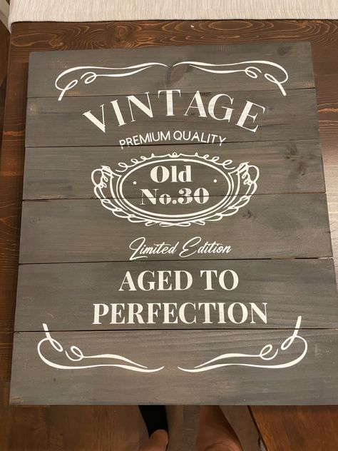 Fun DIY whiskey sign for a 30th birthday party! Pulled inspo from all over pintrest! To save dome money i found this sign at Goodwill and brought it down to the bare bones and stained it with some stain we already had at the house. Created a template using my Cricut and used a foam brush to dab paint over the template to prevent a lot of runs. This took quite a bit of time and patience but was an amazing centerpice for the party! Diy Whiskey, 30th Birthday Sign, Birthday Extravaganza, Rustic Birthday, Birthday Signs, 30th Birthday Party, Age 30, 30th Birthday Parties, Aged To Perfection