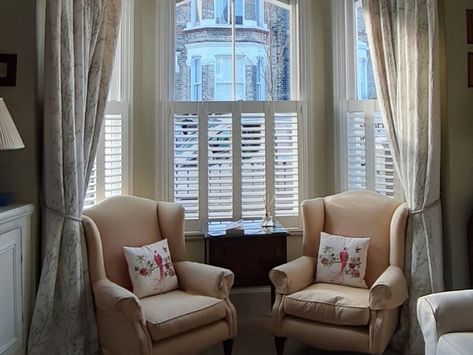 How to dress a bay window: shutters, blinds and more – The Shutter Shop Bay Window Shutters And Curtains, Bay Window Dressing Ideas, Shutters And Curtains Together, Curtains With Shutters, Bay Window Dressing, Windows With Shutters, Victorian Style Bedroom, Cottage Bathroom Design Ideas, Blinds And Curtains Together