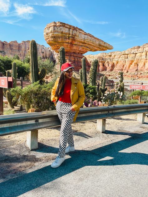 Lightening McQueen Disneybound outfit idea featuring a red bodysuit, black and white checkered jeans, and a yellow leather jacket. Disney Cars Land Outfit, Cars Land Outfit, Cars Disney Outfit, Disney California Adventure Outfit, Cars Disneybound, California Adventure Outfit, Disney Outfits Disneybound, Disney Cars Movie, Disney Photo Ideas