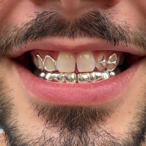 London and NYC book through my website! We’re international now :) Creative freedom custom shape, windows and 2x4 teeth on bottom in silver #grillz #grillznyc #londongrillz #silver #star Silver Bottom Grillz, Silver Grillz Men, Grillz Men, Bottom Grillz, Teeth Gems, Silver Grillz, Grillz Teeth, Tooth Gems, Grills Teeth