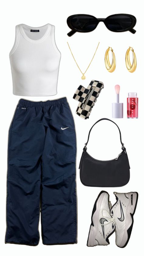 White tank top, navy blue nike track pants, Nike Air Monarch IV, small black handbag, white and black checkered claw clip, Fenty Treatz Hydrating + Strengthening Lip Oil, gold necklace with gold round charm, chunky gold hoops, round black sunglasses Track Pants Outfits, Nike Track Pants Outfits, Track Pants Outfit, Nike Track Pants, Dance Outfit, Pants Outfits, Vintage Pants, Dance Outfits, Pants Outfit