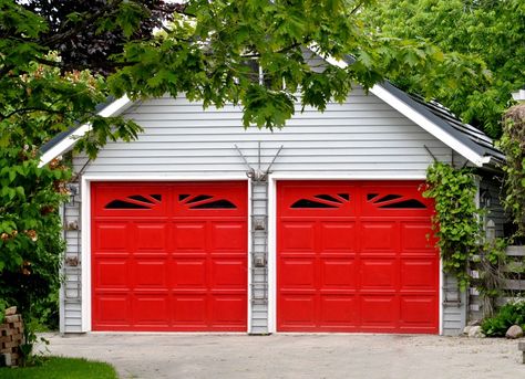 two-car steal garage with red color doors Red Garage Door, Red Garage, Garage Door Colors, Garage Door Hardware, Garage Door Types, Steel Garage Doors, Garage Door Styles, Cool Garages, Wood Garage Doors