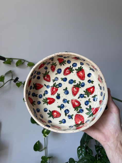 This Hand Painted Deep Salad Plate is a beautifully crafted piece of ceramic art, perfect for serving salads or as a versatile vegetable bowl. Each plate is meticulously hand-painted with a vibrant tomato design, adding a touch of nature's bounty to your table setting. Made from durable stoneware, this plate is not only visually appealing but also practical, being food-safe and suitable for everyday use. It makes a thoughtful and unique ceramic gift for loved ones or a charming addition to your own kitchenware collection. Ideal for those who appreciate handcrafted items with a personal touch. 19.5 cm diameter / 1200 ml 7.67inches diameter / 40.58 fl oz It's an absolutely unique ceramic deep plate because all my creations are made without a pottery wheel or any forms. So please note before Plates With Fruit Design, Plates Pottery Painting, Cool Bowls Ceramics, Pottery Designs Bowl, Fruit Plate Pottery, Pottery Painting Salad Bowl, Fruit Ceramic Painting, Pottery To Make, Ceramic Serving Dish