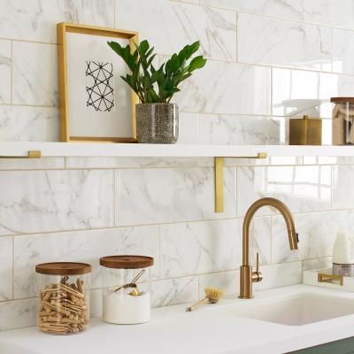 LuxeCraft Calacatta Gold Marble 8 in. x 24 in. Glazed Ceramic Wall Tile (13.3 sq. ft./Case) Gold Tiles Bathroom, Gold Grout, Unicorn House, Basement Kitchenette, Nice Kitchen, Bathroom Accent Wall, Gold Tile, Calacatta Gold Marble, Glazed Ceramic Tile