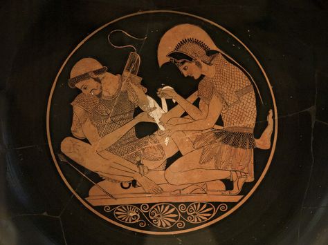 Achilles and Patroklos | "This unique scene on Attic red-figured cup must refer to time before the start of the events in the Iliad. It shows a rarely represented episode from the Trojan war. The two figures are identified by inscriptions: Achilles looks after his friend Patroklos, wounded in the left arm by an arrow. Patroklos turns his head away, twisted with pain, while his friend bandages his wound. "  From T.H. Carpenter’s book “Art and Myth in Ancie... Sacred Band Of Thebes, Ancient Greek Vase, Homer Iliad, Greek Vase, Ancient Greek Pottery, Greek Heroes, Vase Painting, Achilles And Patroclus, Greek Pottery