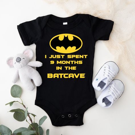 This adorable graphic Onesie® for the “Batman” enthusiast, this is a very popular item for babies. This is one of my "Best Sellers" and is a great baby shower or new baby gift. These can be customized in your choice of vinyl color as shown. Garments come only in Black, Gray & White. Onesies® come in a variety of sizes of your choice. We use high quality, soft flex vinyl which not only creates a sharp, vivid graphic but will never look "faded" or “washed out” like some inks commonly do. Processin Custom Onesies Boy, Baby Boy Batman, Batman Nails, The Batcave, Superhero Baby Shower, Baby Batman, Graphic Onesies, Batman Inspired, Batman Pictures