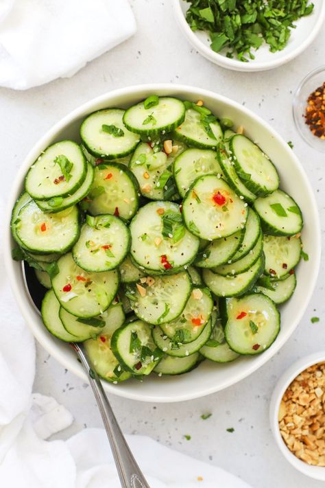 This Thai-style cucumber salad recipe is fresh, light, and the perfect easy side dish for chicken satay, curry, summer BBQs, and more! Cool, crisp cucumbers get tossed in a tangy Thai dressing to make a delicious side dish you can enjoy any time. Get the recipe for this Asian cucumber salad and more side dish recipes to try at One Lovely Life Thai Side Dishes, Satay Curry, Curry Side Dishes, Thai Dressing, Thai Cucumber Salad, Cucumber Salad Recipe, Asian Cucumber Salad, Side Dishes For Chicken, Cucumber Recipes Salad