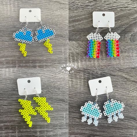 Handmade weather themed kandi perler drop earrings  HIGHLIGHTS: ⭐️ Fully customizable  ⭐️ Hypoallergenic earrings w/ rubber back ⭐️ High-quality & durable ⭐️ One-of-a-kind, unique design ⭐️ Includes FREE GIFTS! ⭐️ Handmade with PLUR ⭐️ Eco-friendly packaging & shipping Everything in my shop is hand-made and are all original designs!  Supporting my small business means the world to me so as a thank you to my amazing customers, every order also includes free gifts! (Bigger orders = bigger gifts 😊) Please note- all of my items are hand-made and unique, so they may not look the exact same as the photos.  If you have any questions, want to customize this listing, and/or commission Kandi, please send me a message! PERLERS- please handle gently and avoid exposure to excessive heat Perler Bead Pattern Earrings, Perler Bead Charms, Kandi Perler, Perler Earrings, Storm Lightning, Melt Beads Patterns, Bolt Earrings, Easy Perler Beads Ideas, Lightning Bolt Earrings