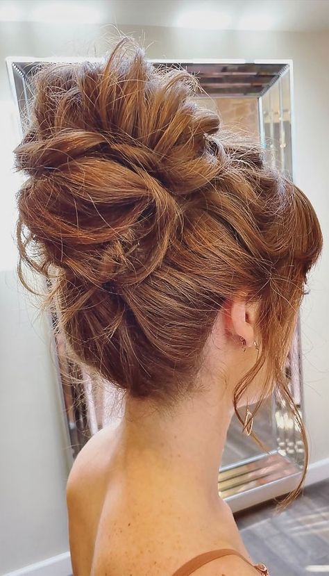 50+ Updo Hairstyles That're So Stylish : 90s High Bun Poofy Updo Hairstyles, 90s High Bun, Updo Volume On Top, Glamorous Hair Updo, Voluminous Updo Wedding, Celebrity Hairstyles Updo, Big Hair Updo Messy, Big Hairstyles Volume Wedding Updo, Racing Wedding