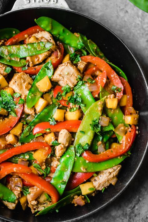 Deliciously flavorful mango chicken stir fry made in one pan with plenty of bright veggies. This easy stir fry is protein-packed and perfect for meal prep! Serve with quinoa, brown rice or cauliflower rice for a full meal. #chickenrecipe #chickendinner #mango #onepanmeal #mealprep #stirfry Mango Stir Fry, Mango Chicken, Ambitious Kitchen, Sweet Potato Noodles, Frying Pans, Chicken Stir Fry, Diet Vegetarian, Stir Fry Recipes, One Pan