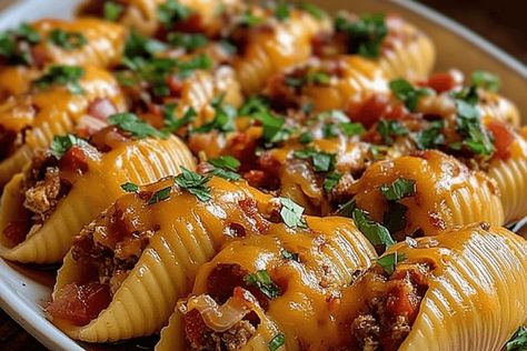 Air Fryer Taco Stuffed Shells are a crispy and delicious twist on traditional tacos and pasta. Fill jumbo shells with seasoned ground beef, cheese, and taco seasoning, then air fry to perfection. Perfect for Taco Tuesday or any meal, these shells are easy to make and packed with flavorful goodness. Sloppy Joes Dip, Traditional Tacos, Jumbo Shells, Taco Spice, Jumbo Pasta Shells, Queso Cheese, Mexican Cheese, Taco Stuffed Shells, Stuffed Pasta Shells