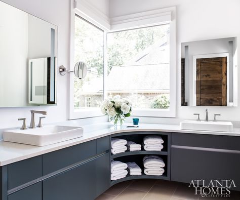 “With modern homes, you can get away with doing two corner windows like in the bathroom,” says Patrick of the unique window layout. The goal was to keep the room sophisticated but pared down, using simple can lighting, LED mirrors and hardware-free cabinets, which are painted a serene Down Pipe by Farrow Corner Windows, Harrison Design, Lighting Layout, Fresh Farmhouse, Corner Window, Modern Window, Master Bath Remodel, Modern Farmhouse Design, Atlanta Homes