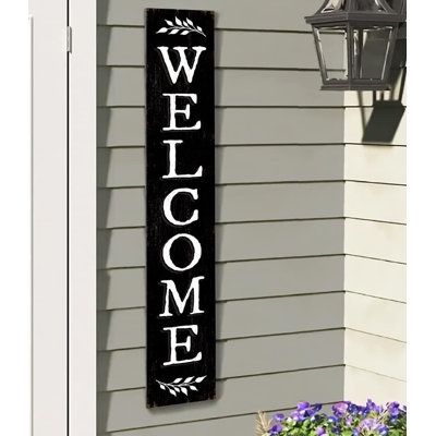 This handcrafted Porch Board Hanging Welcome Sign and Porch leaner is made of a specially developed, 100% weatherproof, composite material that will not rot, warp, or fall apart with rain. It is printed with weatherproof UV Inks that won’t fade, peel or crack. It measures 8” high x 46.5” wide x .4” thick, weighs 3.5 lbs. and is designed for both Outside and Inside home, door and porch decoration use. Rosalind Wheeler Colour: Black | Rosalind Wheeler Welcome Sign and porch leaner for Front Door, Welcome Sign Porch, Hanging Welcome Sign, Yard Deck, Door Porch, Front Door Porch, Deck Patio, Composite Material, Outdoor Wall Decor, Patio Deck