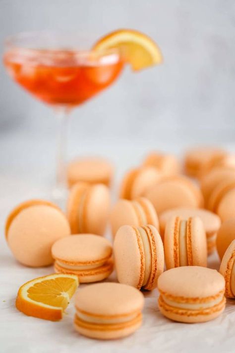 Aperol macarons - Everything Marina French Macarons Recipe, Spritz Cocktail, Chocolate Macaron, Macaron Flavors, Meringue Recipe, Macaron Cookies, French Macaroons, Melting White Chocolate, White Chocolate Ganache