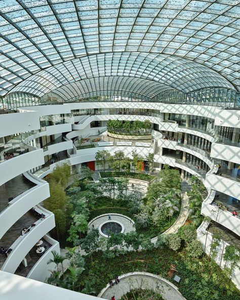 The Albert Einstein Education and Research Center (AEERC) in São Paulo, Brazil was designed as an urban oasis, integrating laboratory spaces, classrooms, and communal areas around a vaulted, skylit atrium garden. The central garden serves as a hub for interaction, collaboration, and relaxation, visible from nearly every part of the building. AEERC, adjacent to Hospital Israelita Albert Einstein, is a significant project by the Sociedade Beneficente Israelita Brasileira Albert Einstein, markin... Hospital Garden, Atrium Garden, Communal Space, Research Centre, Research Center, In Hospital, Urban Oasis, Street Furniture, Futuristic Architecture