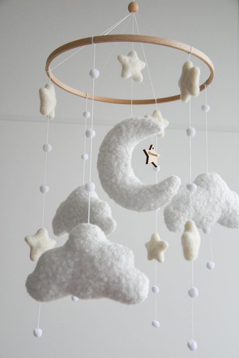 This Personalized Boucle handmade Cloud Baby Mobile will be a perfect fit for the neutral nursery. Our style is defined by simplicity and muted/natural tones. The design is perfectly balanced so mobiles don't look too busy. Our mobiles are light and calming to ensure your little one gets the best experience. Also the mobiles don't contain beads. The size. The diameter of the ring is 23 cm. Full length ~ 45-50 cm. Different colors are possible. Materials Beech wood ring Hypoallergenic felt (100% Moon Baby Nursery, Stars Mobile, Ikea Nursery, Cloud Mobile, Star Mobile, Moon Baby, Baby Room Inspiration, Cadeau Baby Shower, Nursery Organization